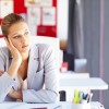 bored-woman-daydreaming-at-desk-office